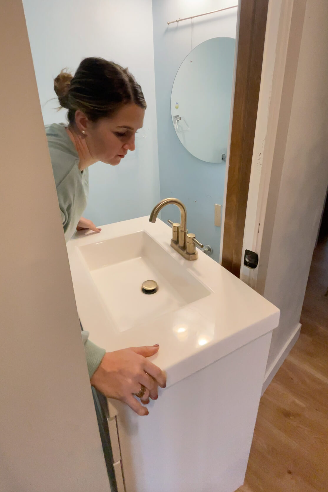 Removing a vanity from the bathroom.